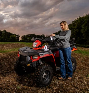 woman with atv in field