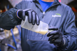Image of pouring milk sample for testing